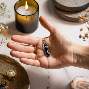 Fekete achát medál tasakban + lánc